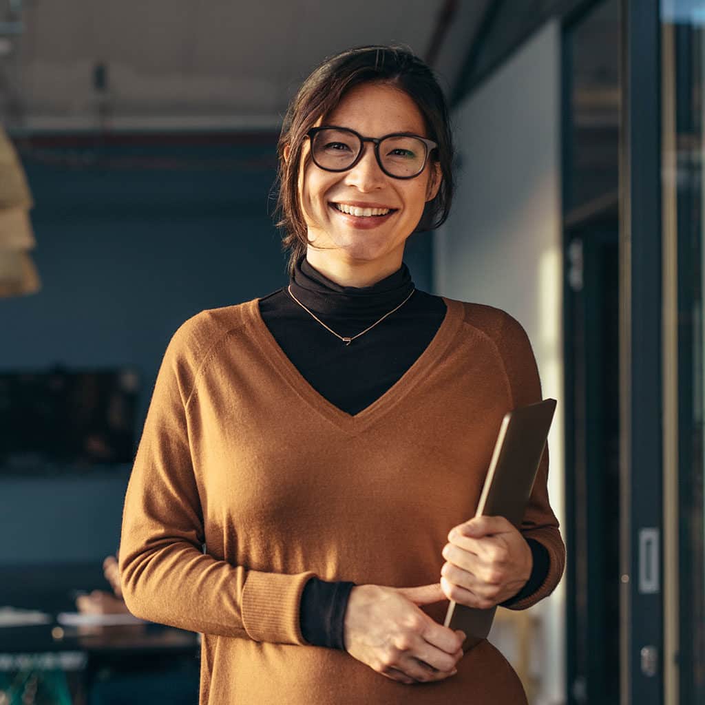 Smiling business woman in casuals at office
